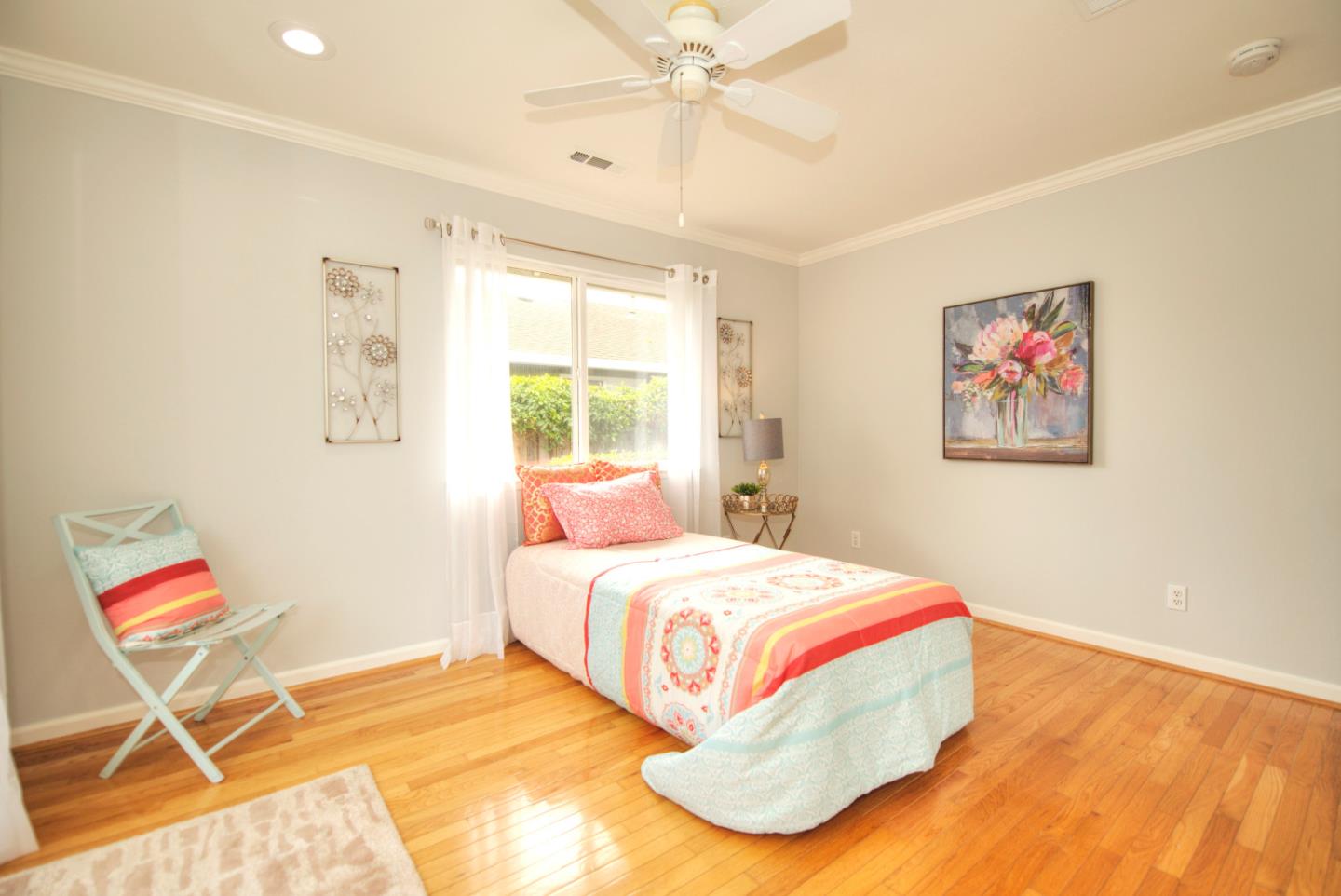 1396 Fallen Leaf Drive Milpitas, CA 95035 - Photo 31 of 43 a bedroom with a bed and a painting on the wall