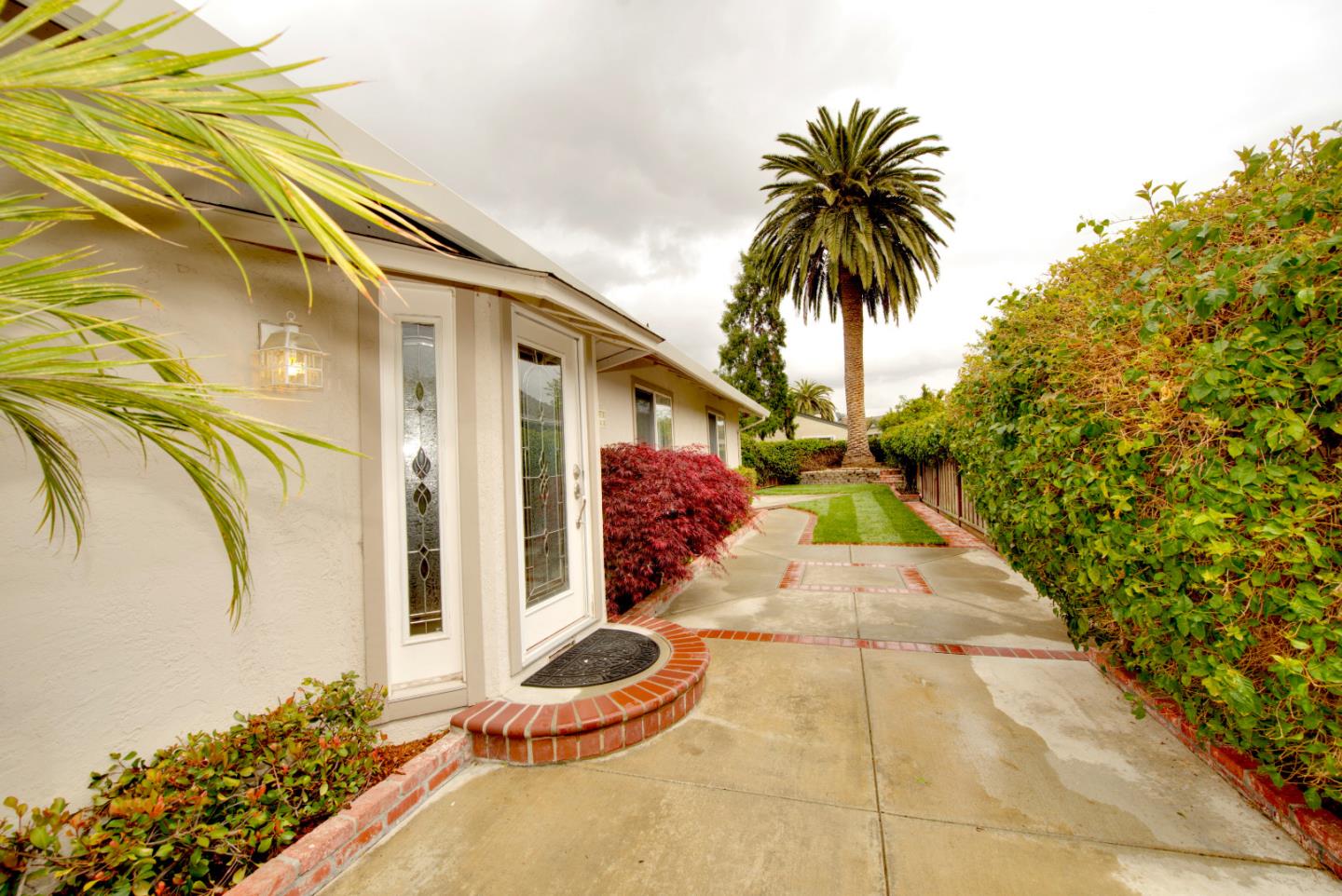 1396 Fallen Leaf Drive Milpitas, CA 95035 - Photo 39 of 43 a view of a patio with table and chairs potted plants
