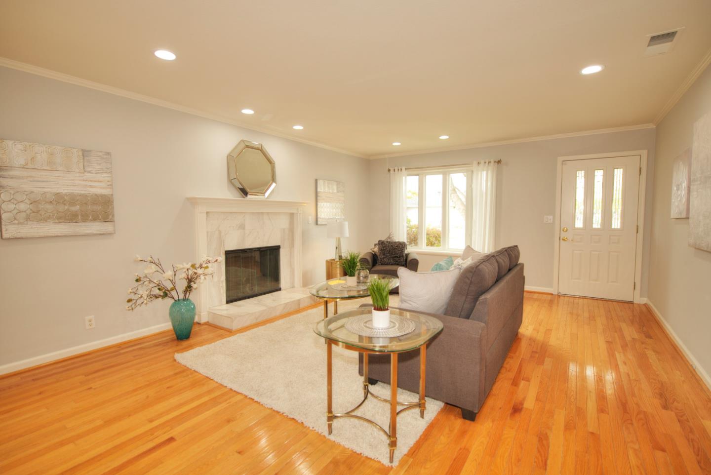 1396 Fallen Leaf Drive Milpitas, CA 95035 - Photo 4 of 43 a living room with furniture and a fireplace
