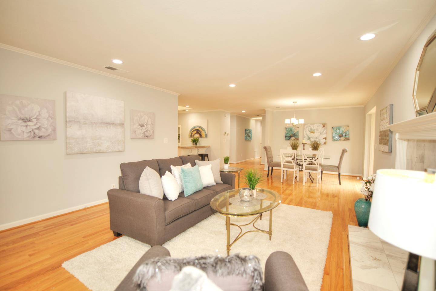 1396 Fallen Leaf Drive Milpitas, CA 95035 - Photo 6 of 43 a living room with furniture and a wooden floor