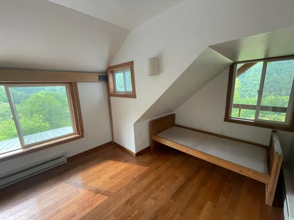 a view of a balcony with wooden floor