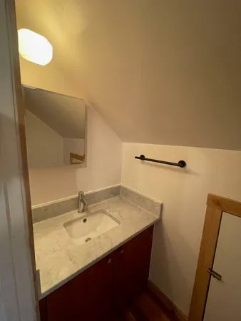 a kitchen with wooden cabinets and sink