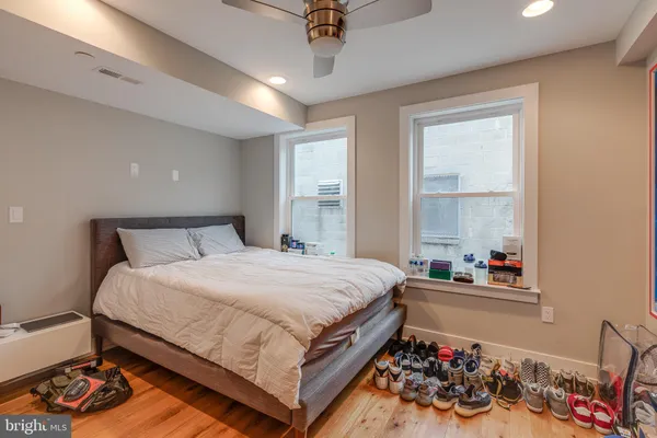 a bedroom with bed and a window