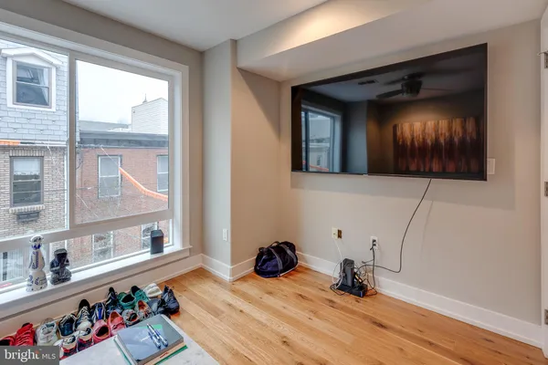 a view of a entryway door of the house and living room