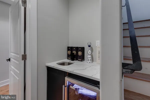 a kitchen with a sink and a refrigerator