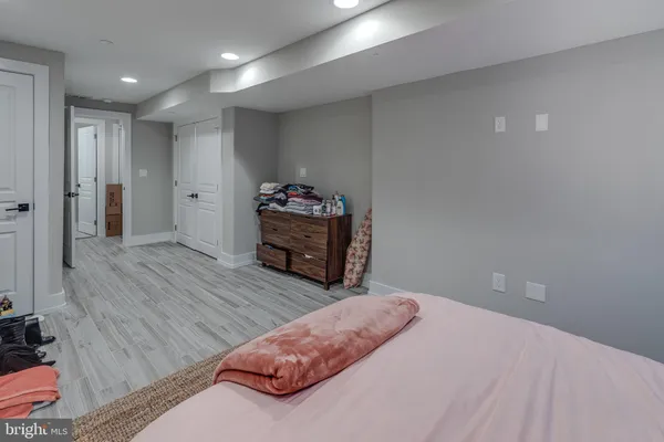 a bedroom with bed and a dresser