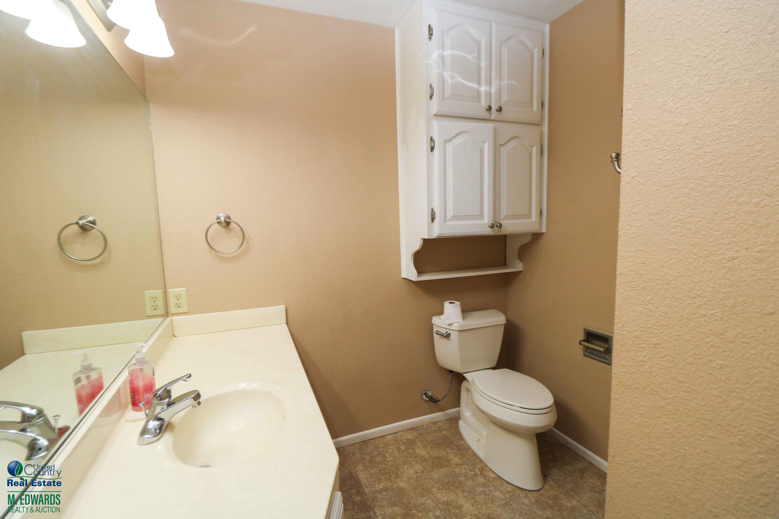200 Crescent Drive Littlefield, TX 79339 - Photo 18 of 25 a bathroom with a sink and toilet