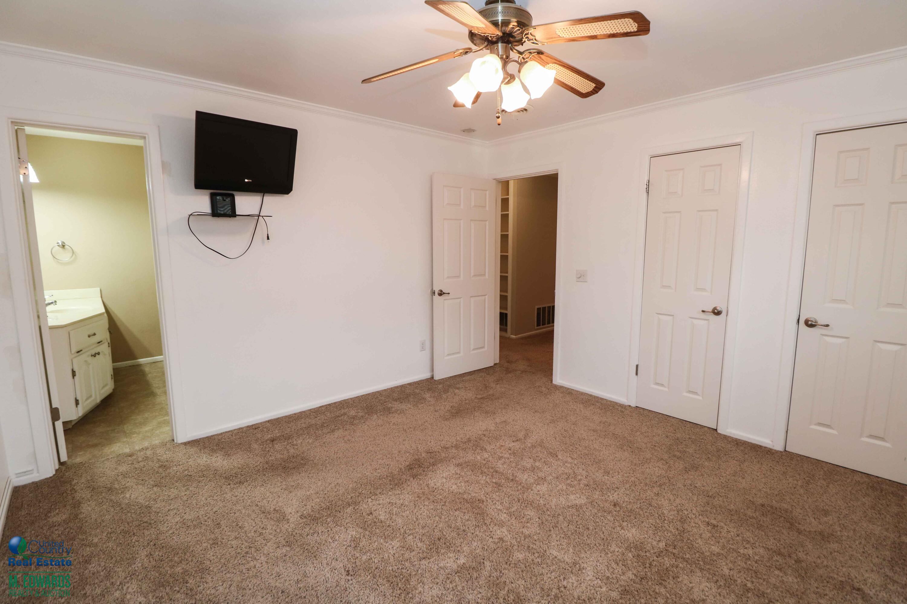 200 Crescent Drive Littlefield, TX 79339 - Photo 19 of 25 a view of a livingroom with a flat screen tv