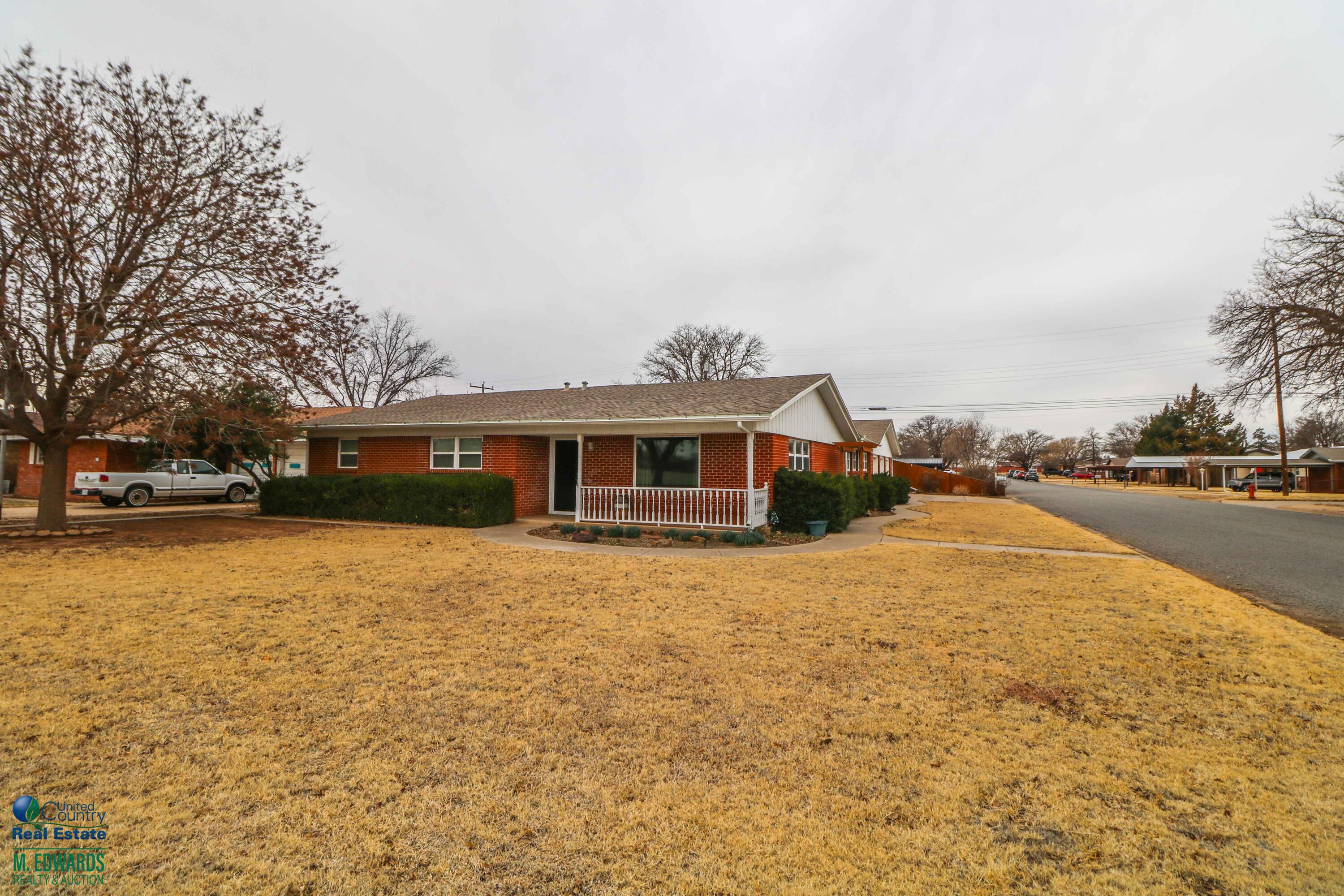 200 Crescent Drive Littlefield, TX 79339 - Photo 2 of 25 a yellow house with trees in front of it