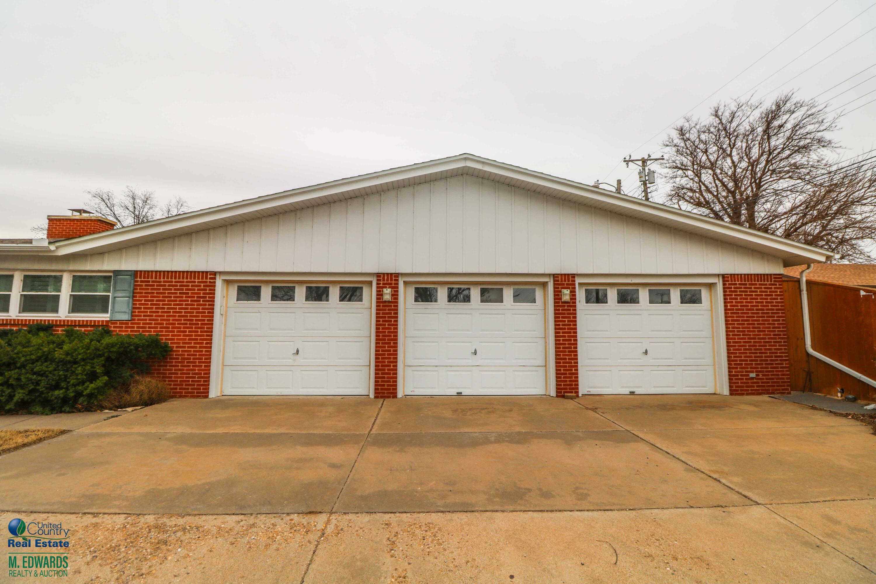200 Crescent Drive Littlefield, TX 79339 - Photo 3 of 25 a front view of a house with garage