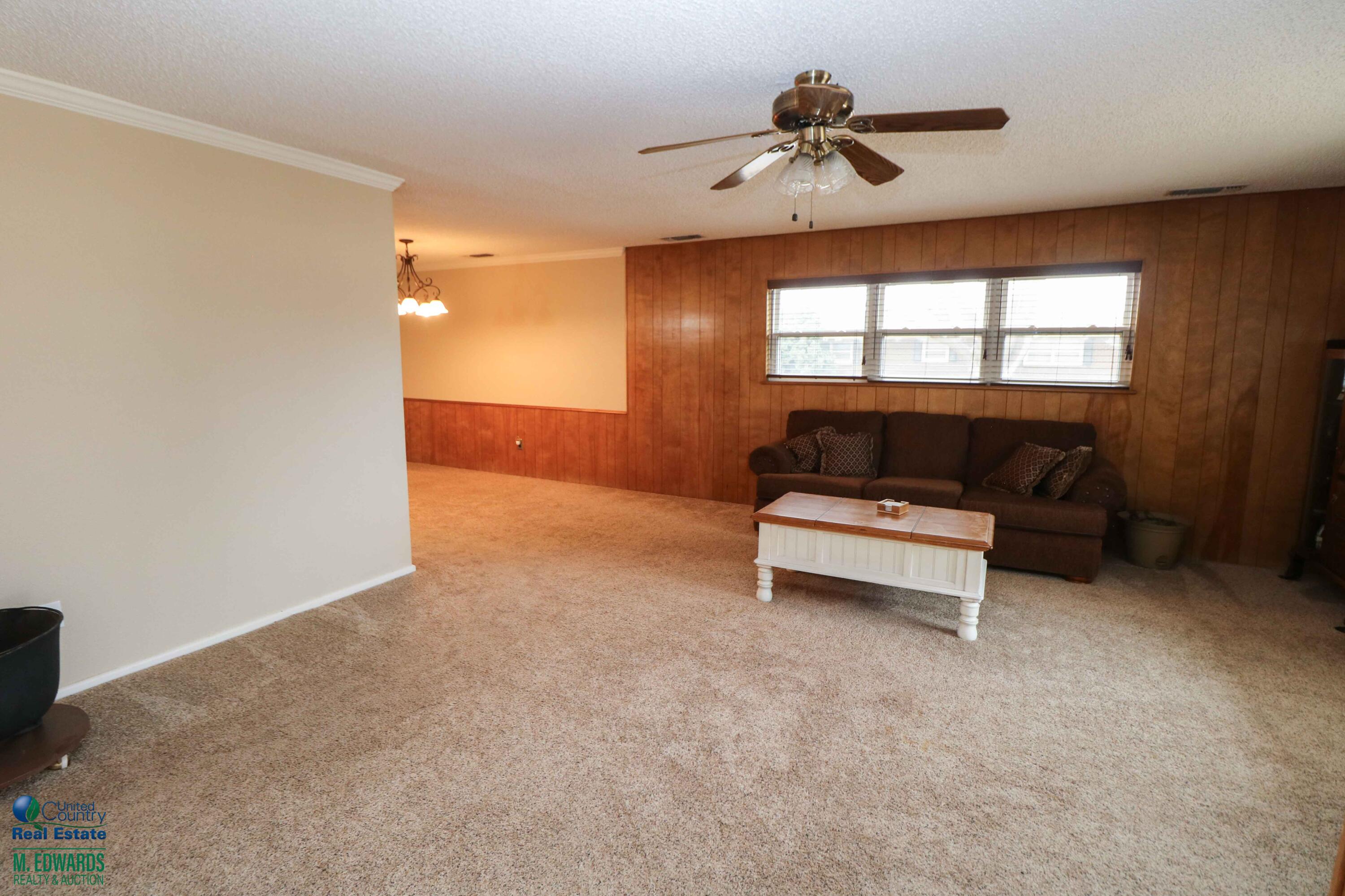 200 Crescent Drive Littlefield, TX 79339 - Photo 5 of 25 a living room with furniture and a window