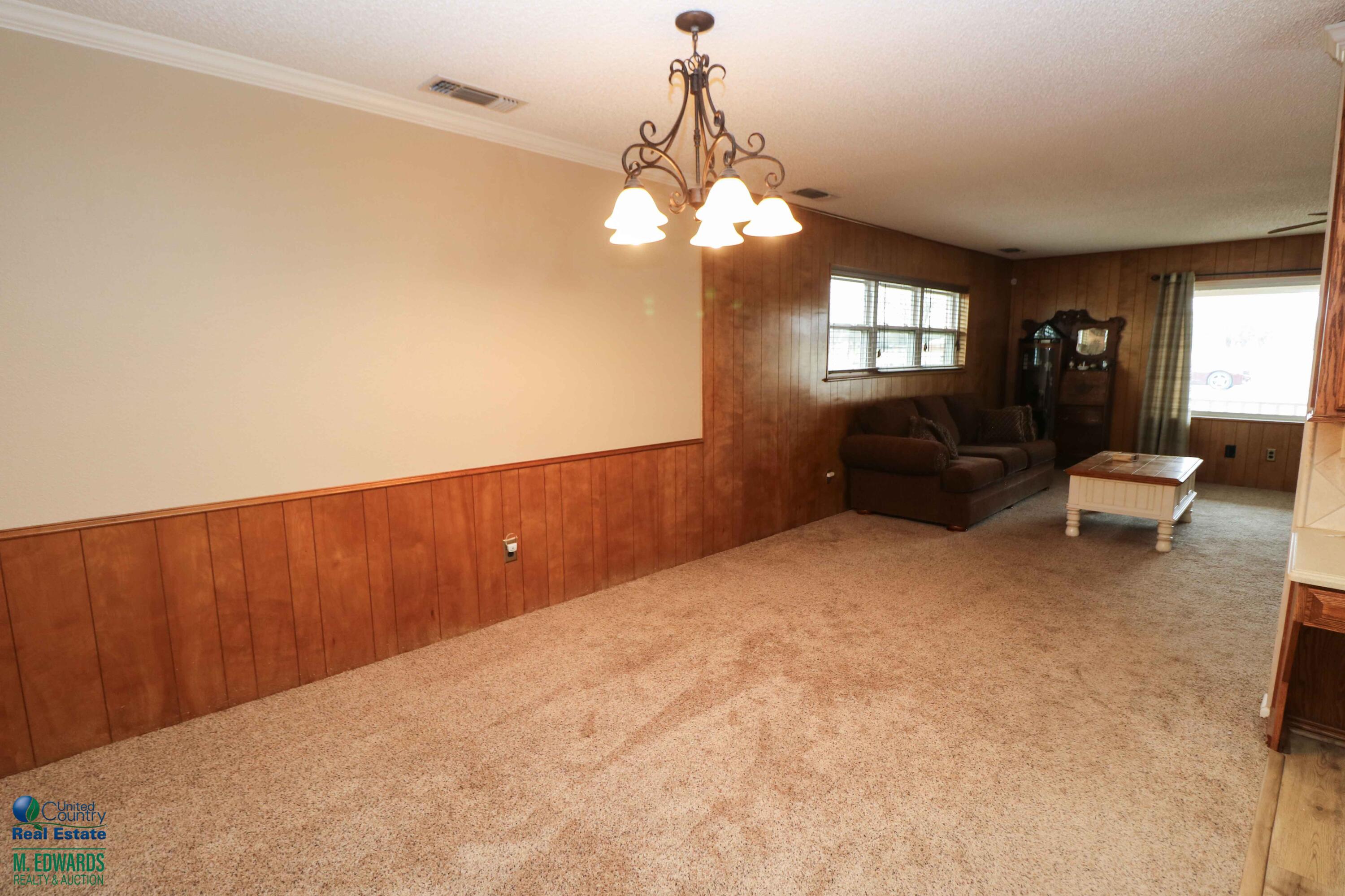 200 Crescent Drive Littlefield, TX 79339 - Photo 9 of 25 a view of a livingroom with furniture window and wooden floor