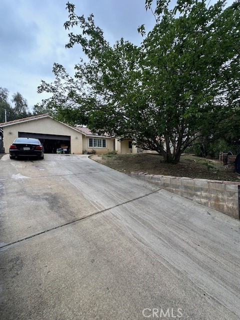 a view of backyard with barbeque and outdoor seating