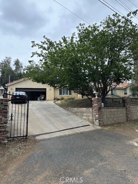 4485 Riverview Drive Riverside, CA 92509 - Photo 2 of 36 a view of a house with a garage