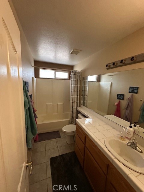 4485 Riverview Drive Riverside, CA 92509 - Photo 23 of 36 a bathroom with a double vanity sink toilet and shower