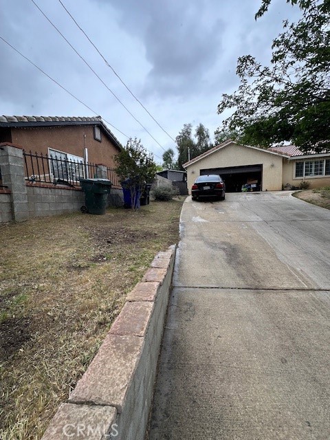 4485 Riverview Drive Riverside, CA 92509 - Photo 3 of 36 a front view of a house with a yard