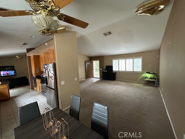 4485 Riverview Drive Riverside, CA 92509 - Photo 8 of 36 a view of a livingroom with furniture and a ceiling fan