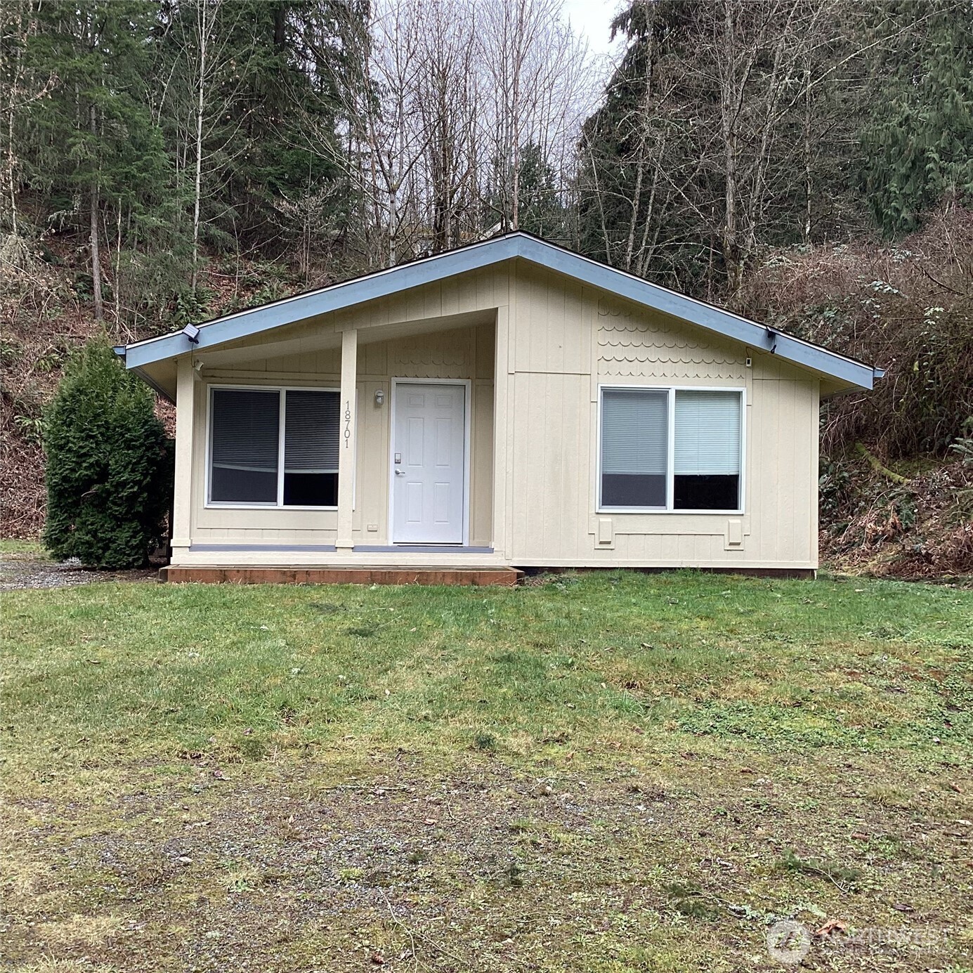 18701 Larch Way Bothell, WA 98012 - Photo 1 of 34 a house with yard in front of it