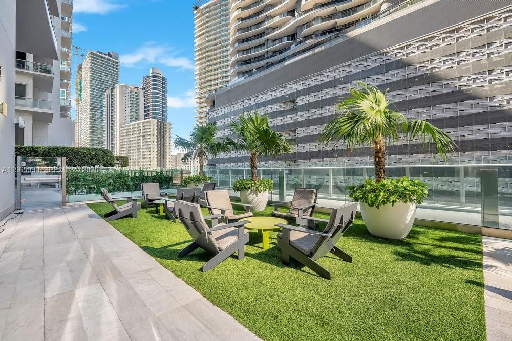 1010 Brickell Avenue, Unit 4011 Miami, FL 33131 - Photo 23 of 32 a view of a swimming pool with outdoor seating