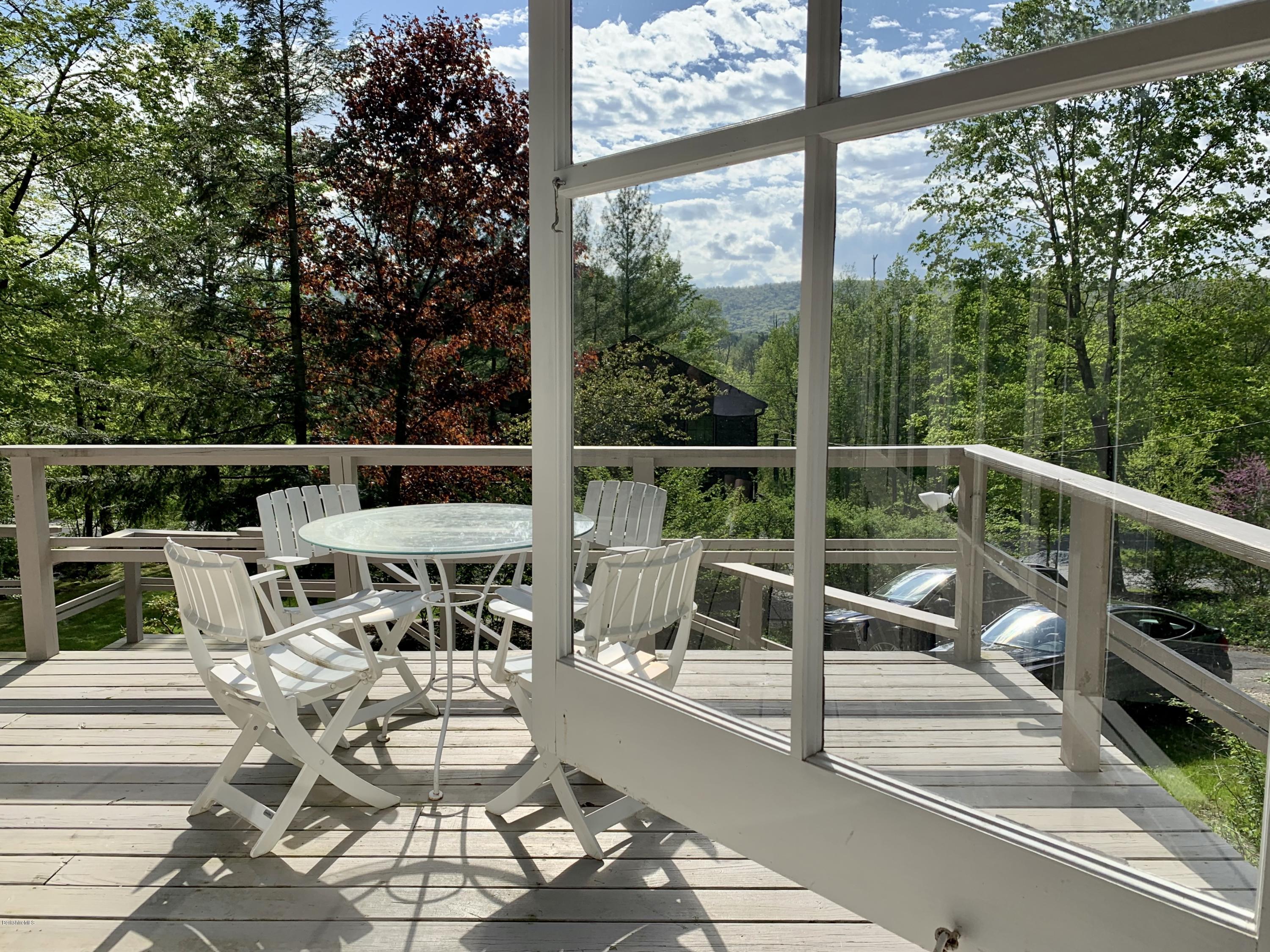 22 Mahkeenac Road Stockbridge, MA 01262 - Photo 1 of 24 a view of balcony with couch and chairs