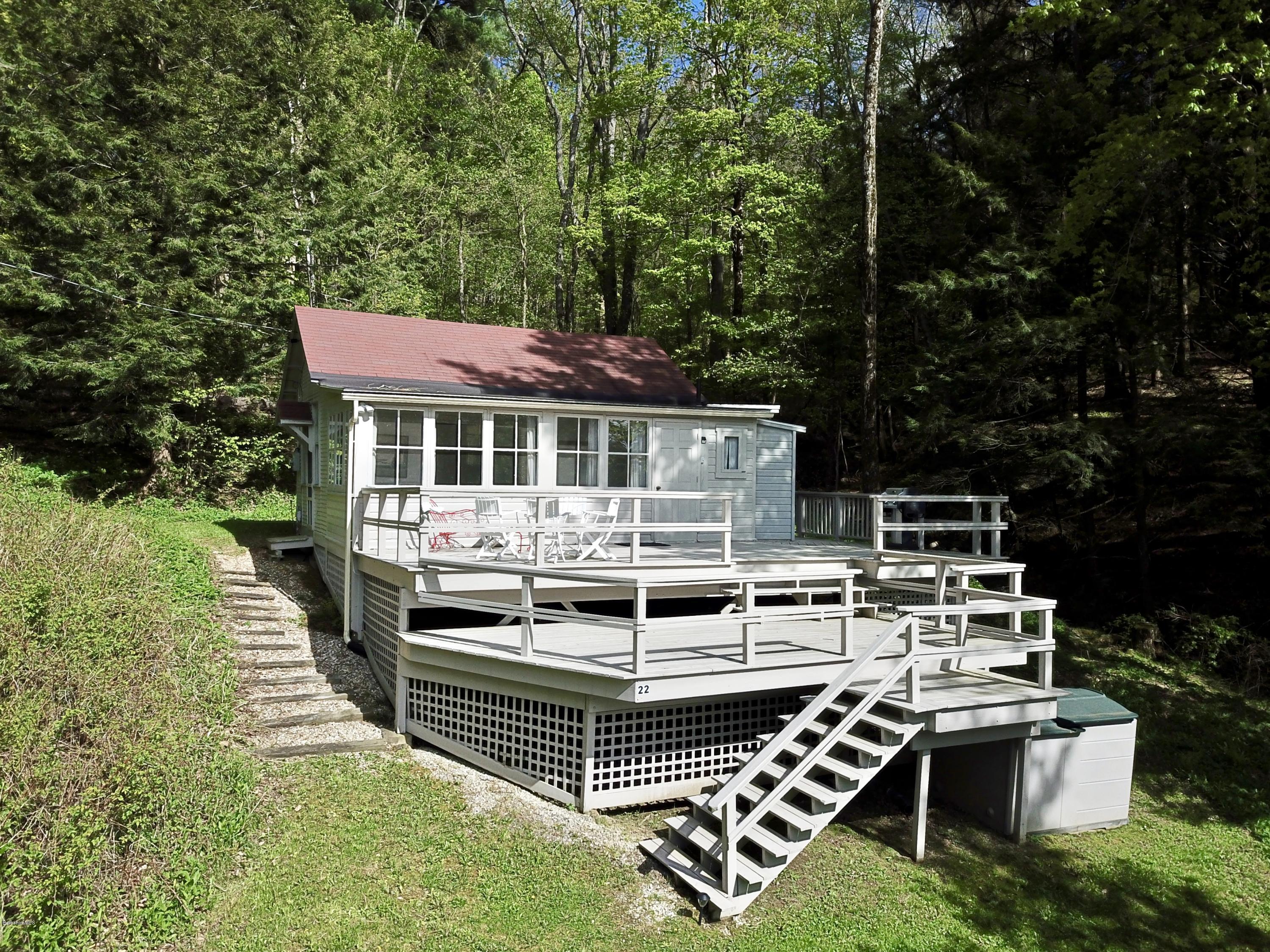 22 Mahkeenac Road Stockbridge, MA 01262 - Photo 2 of 24 a view of a house with backyard porch and sitting area
