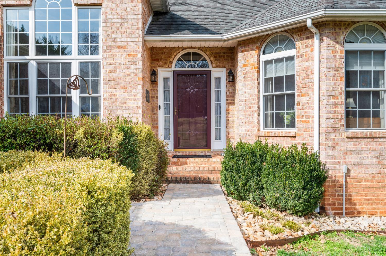 378 Tusculum Lane East Amherst, VA 24521 - Photo 16 of 99 front view of a brick house with a large window