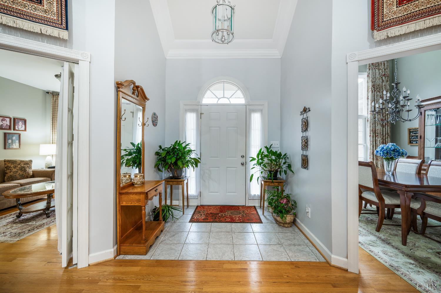 378 Tusculum Lane East Amherst, VA 24521 - Photo 18 of 99 a view of a hallway with dining room and wooden floor