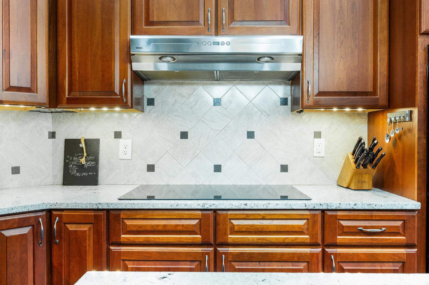 378 Tusculum Lane East Amherst, VA 24521 - Photo 30 of 99 a kitchen with stainless steel appliances granite countertop a sink and cabinets