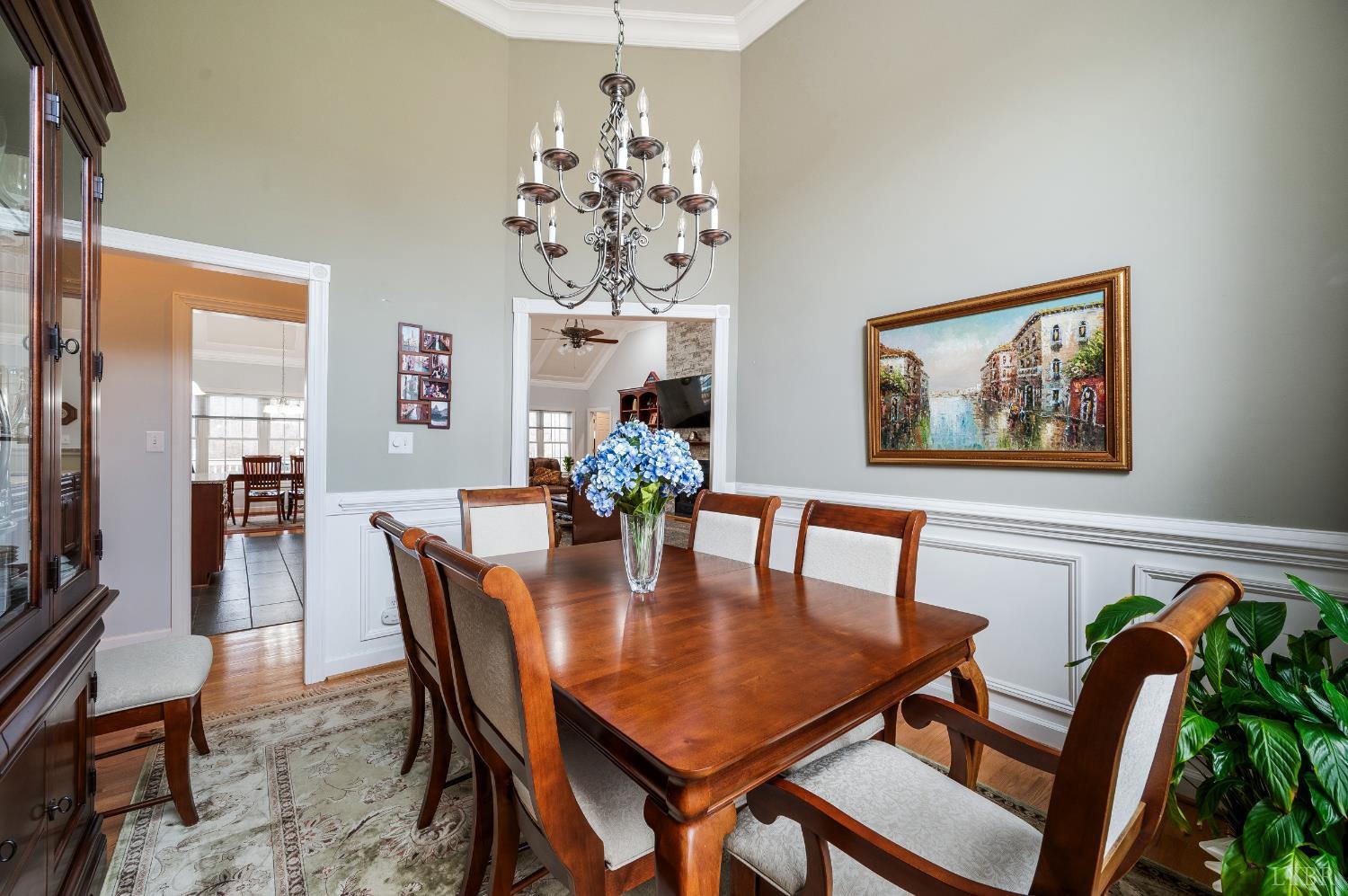 378 Tusculum Lane East Amherst, VA 24521 - Photo 35 of 99 a dining room with furniture a chandelier and wooden floor