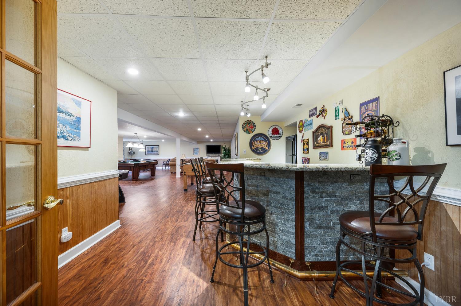 378 Tusculum Lane East Amherst, VA 24521 - Photo 57 of 99 a view of a dining room with furniture wooden floor and a chandelier