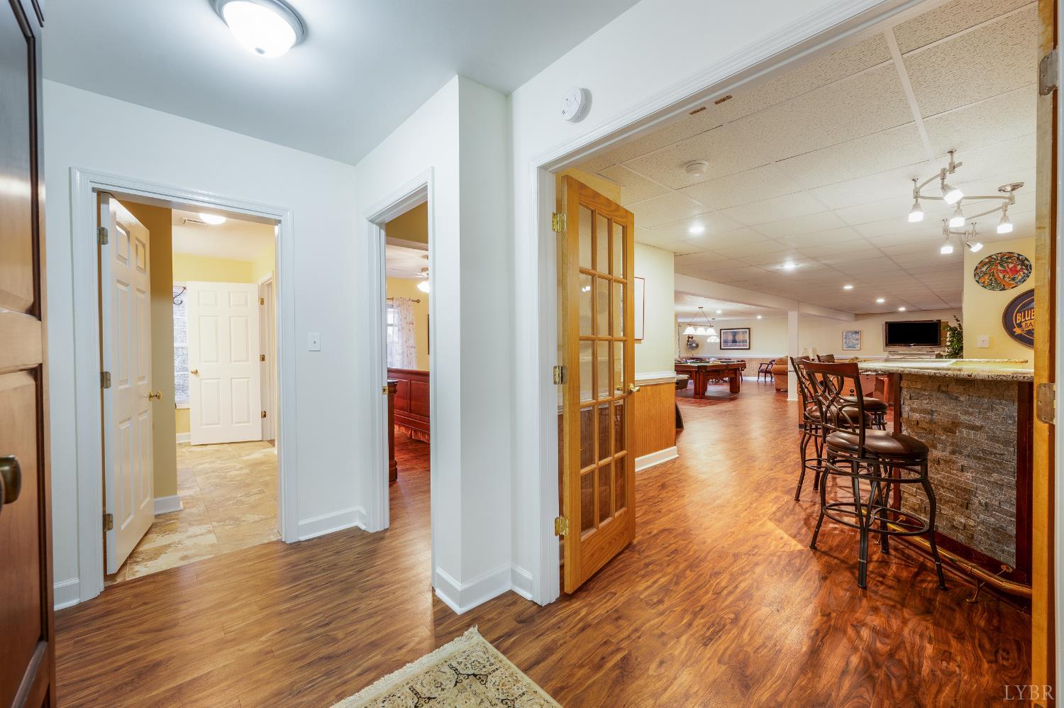 378 Tusculum Lane East Amherst, VA 24521 - Photo 58 of 99 a view of a dining room with furniture and wooden floor