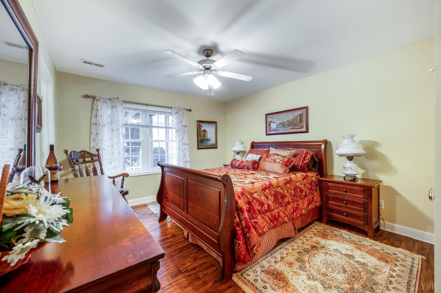 378 Tusculum Lane East Amherst, VA 24521 - Photo 59 of 99 a bed room with a bed window and a dresser
