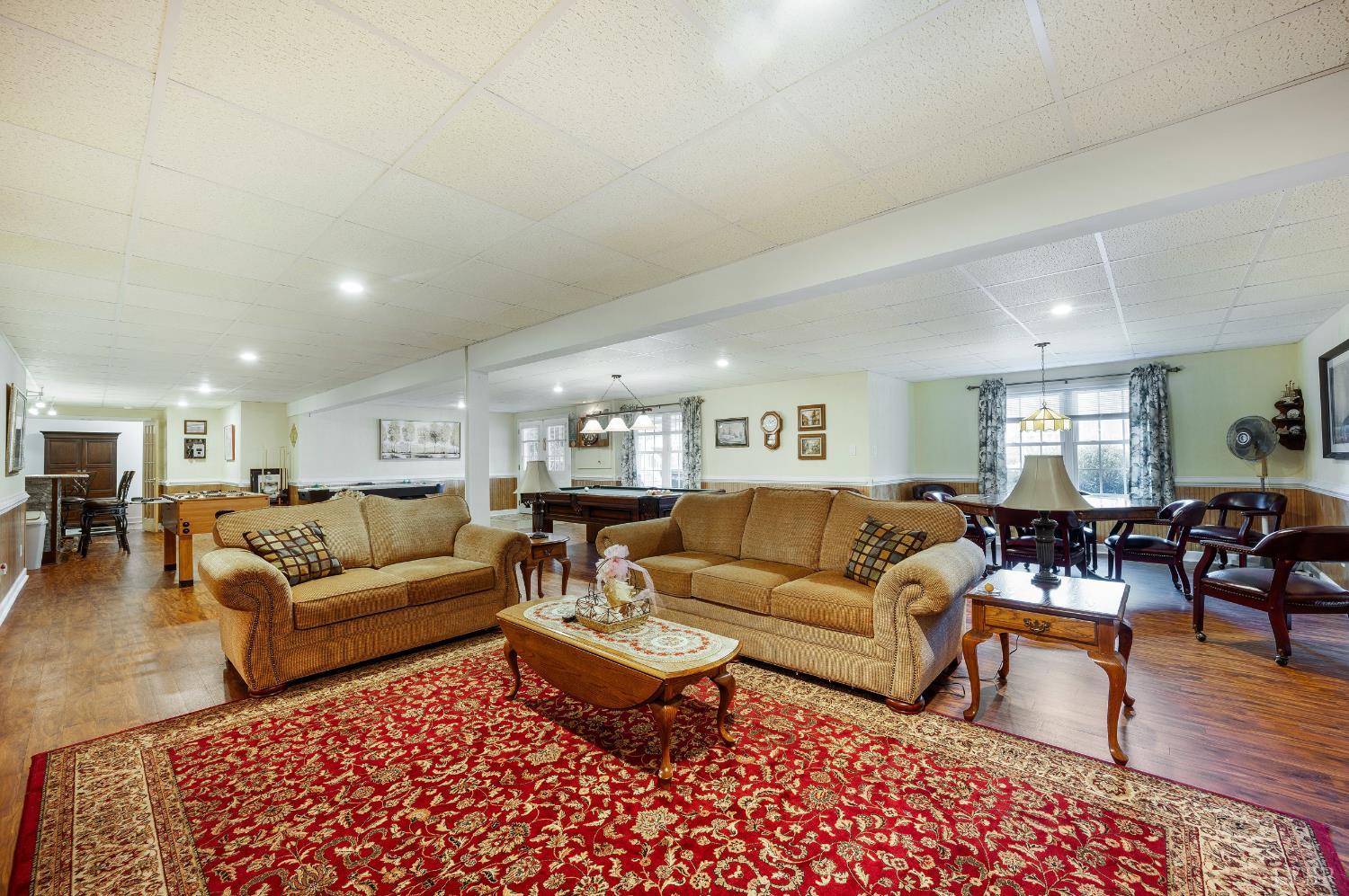 378 Tusculum Lane East Amherst, VA 24521 - Photo 69 of 99 a living room with furniture a rug and a table