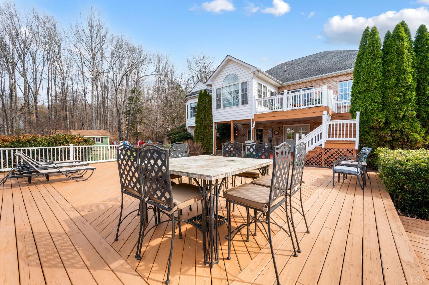 378 Tusculum Lane East Amherst, VA 24521 - Photo 77 of 99 a view of a patio with a table and chairs