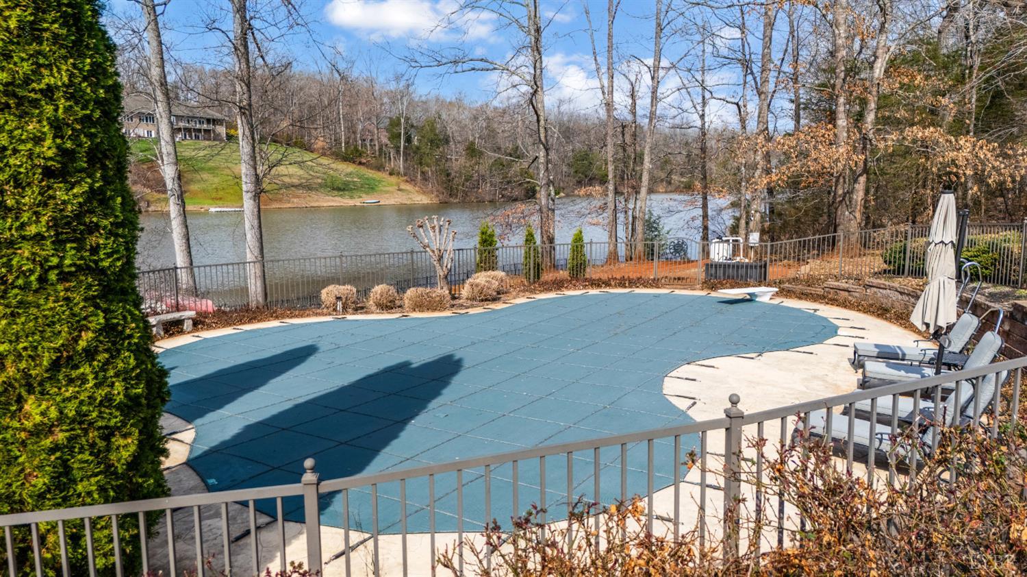 378 Tusculum Lane East Amherst, VA 24521 - Photo 87 of 99 a view of a patio with table and chairs with wooden fence and plants