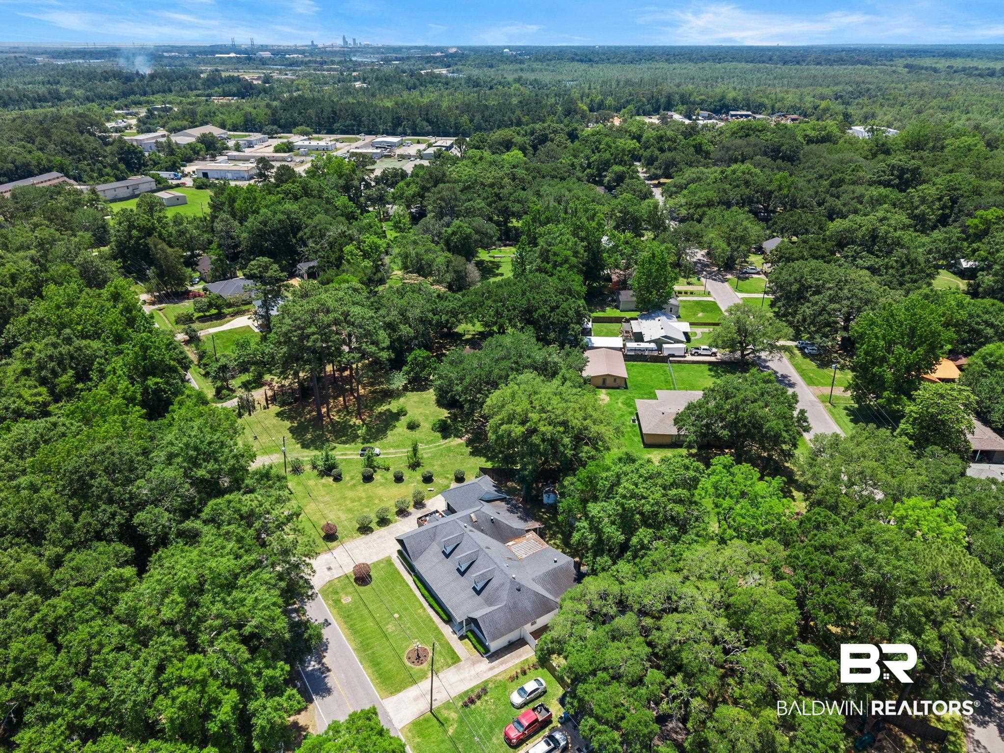 927 Cleveland Road Saraland, AL 36571 - Photo 68 of 80 Aerial perspective showcasing a property surrounded by mature trees