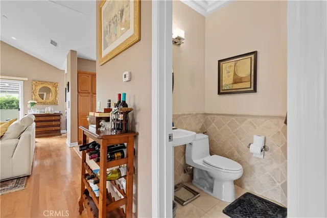 a white toilet sitting next to a bathroom sink