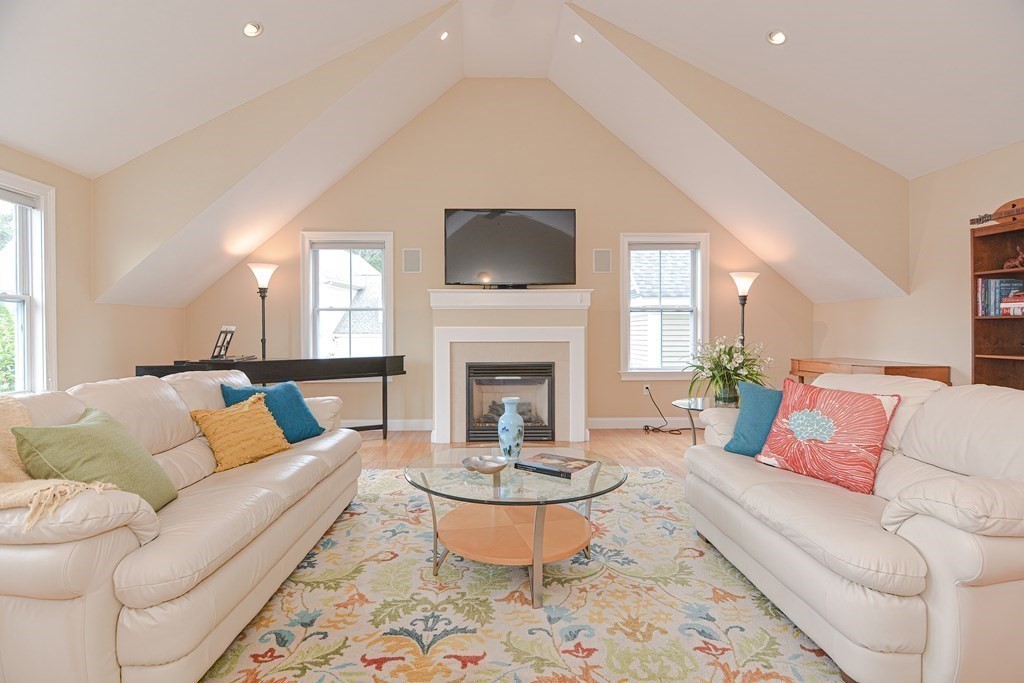 159 Prospect Street, Unit 7 Acton, MA 01720 - Photo 12 of 31 a living room with furniture a window and a fireplace