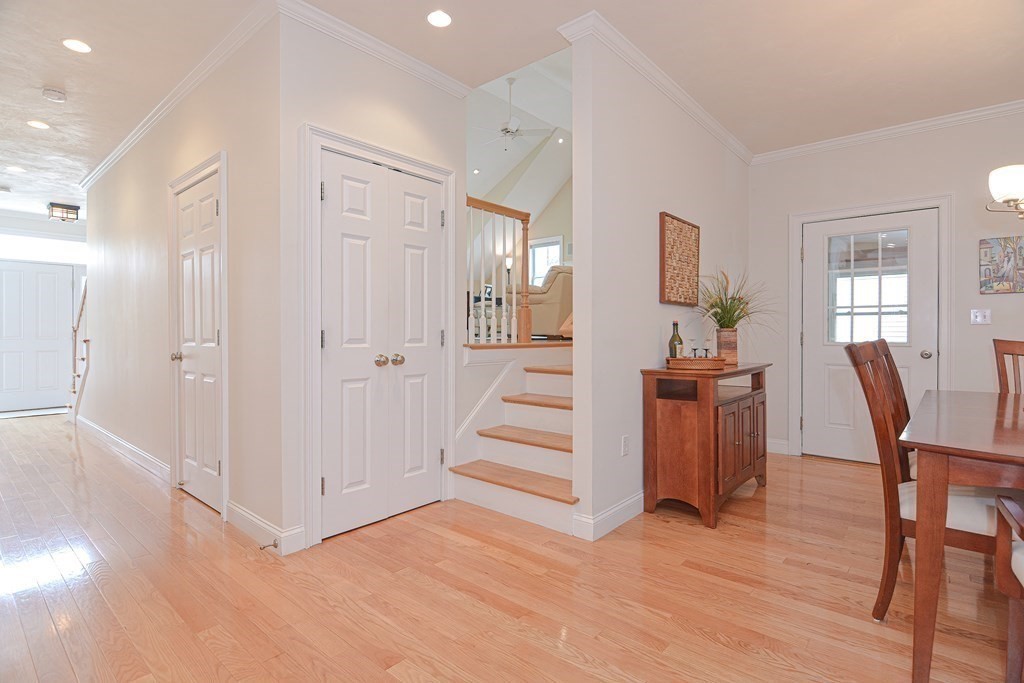 159 Prospect Street, Unit 7 Acton, MA 01720 - Photo 13 of 31 a view of a hallway with wooden floor table and windows