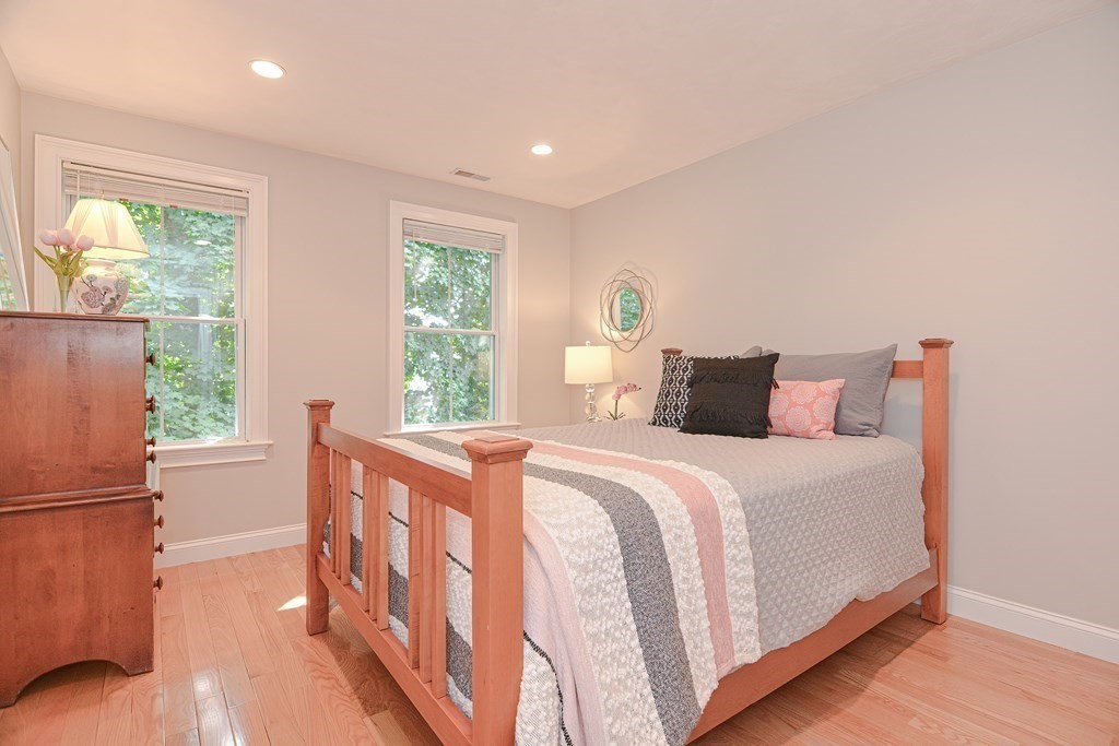 159 Prospect Street, Unit 7 Acton, MA 01720 - Photo 19 of 31 a bedroom with a bed and a large window
