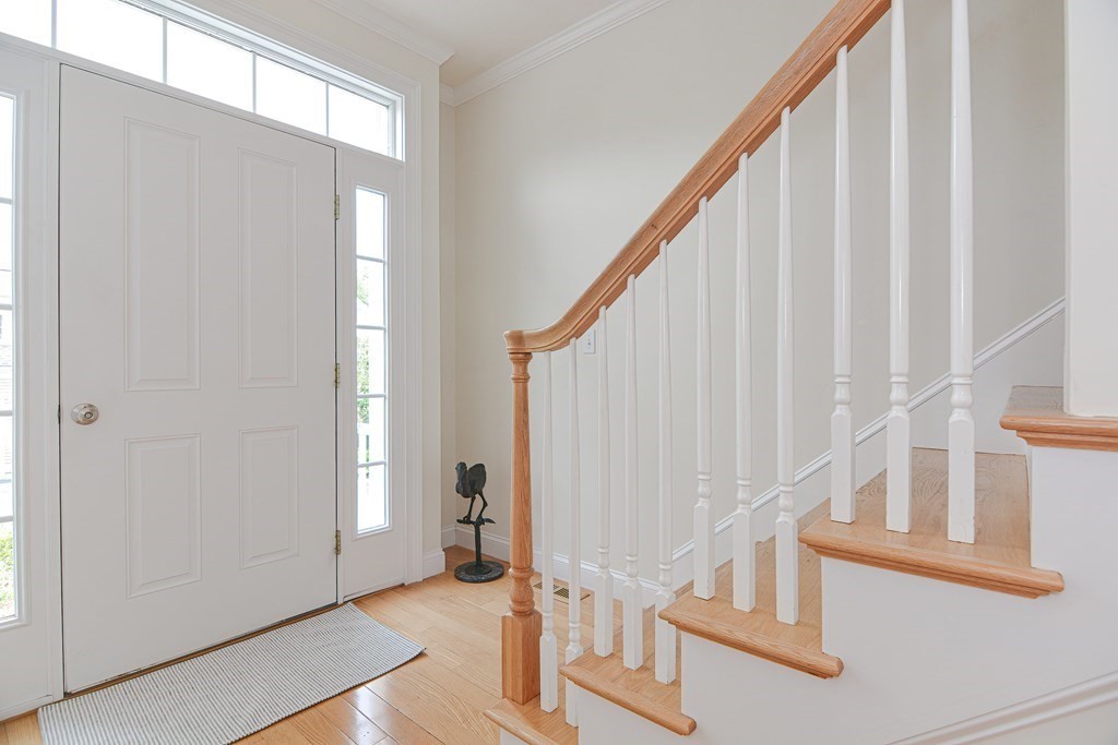 159 Prospect Street, Unit 7 Acton, MA 01720 - Photo 2 of 31 a view of staircase with white walls and a window