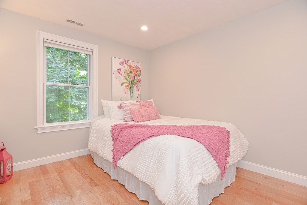 159 Prospect Street, Unit 7 Acton, MA 01720 - Photo 21 of 31 a bedroom with a bed and a window