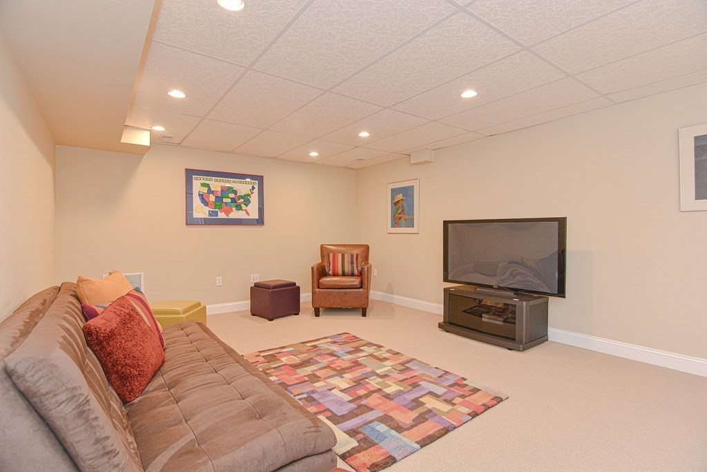 159 Prospect Street, Unit 7 Acton, MA 01720 - Photo 25 of 31 a bedroom with a bed and a television