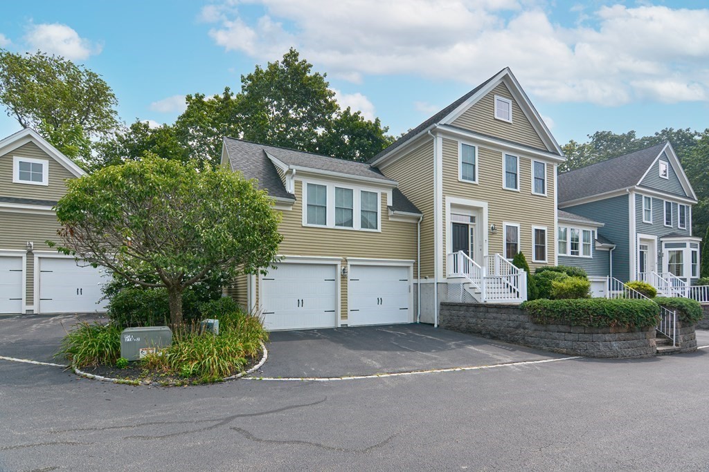 159 Prospect Street, Unit 7 Acton, MA 01720 - Photo 27 of 31 a front view of a house with a garden
