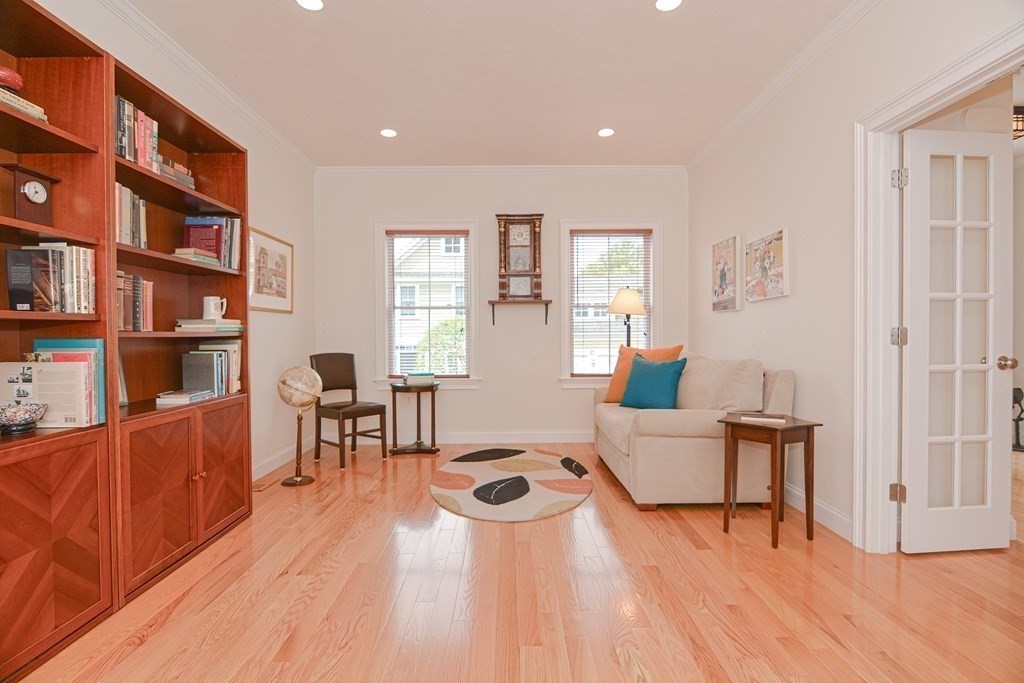 159 Prospect Street, Unit 7 Acton, MA 01720 - Photo 3 of 31 a living room with furniture and a wooden floor