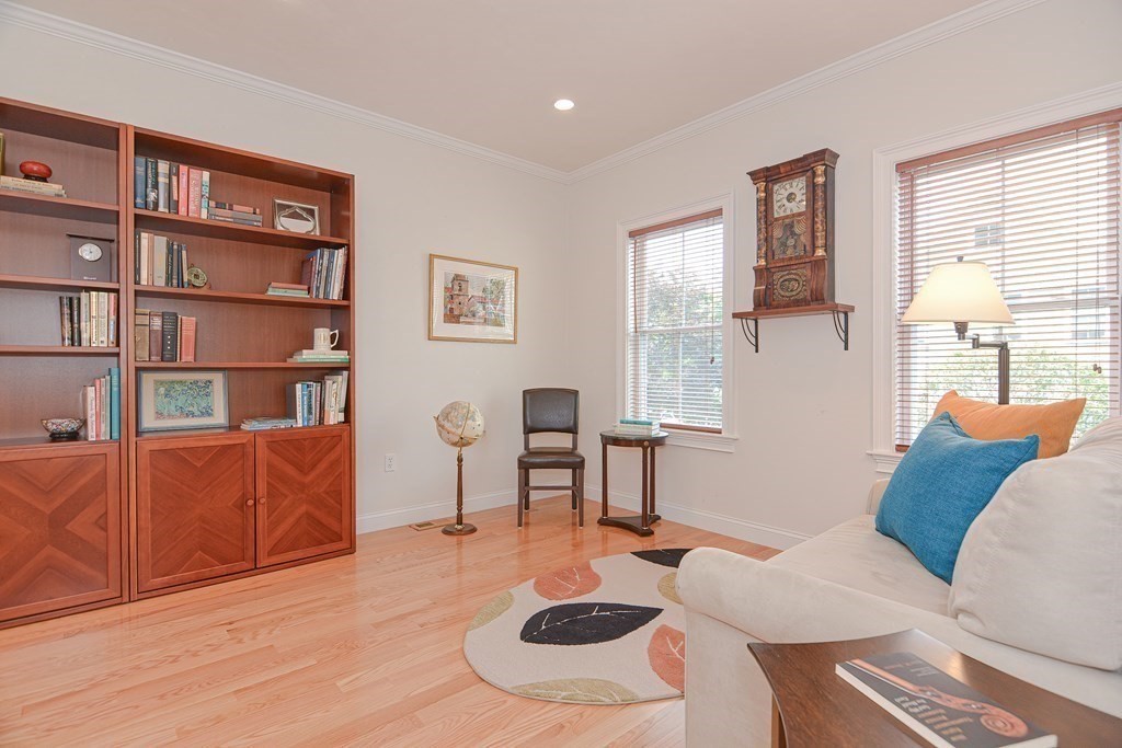 159 Prospect Street, Unit 7 Acton, MA 01720 - Photo 4 of 31 a living room with furniture and a wooden floor