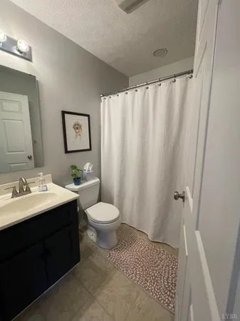 a spacious bedroom with a bed and window