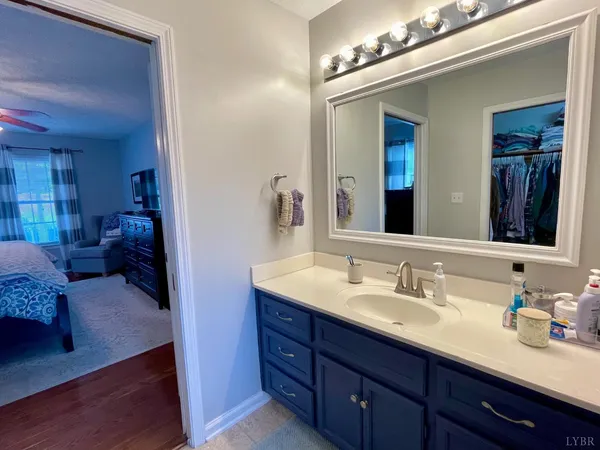 a bathroom with a sink double vanity and a mirror