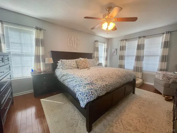 a living room with a lots of furniture and a rug