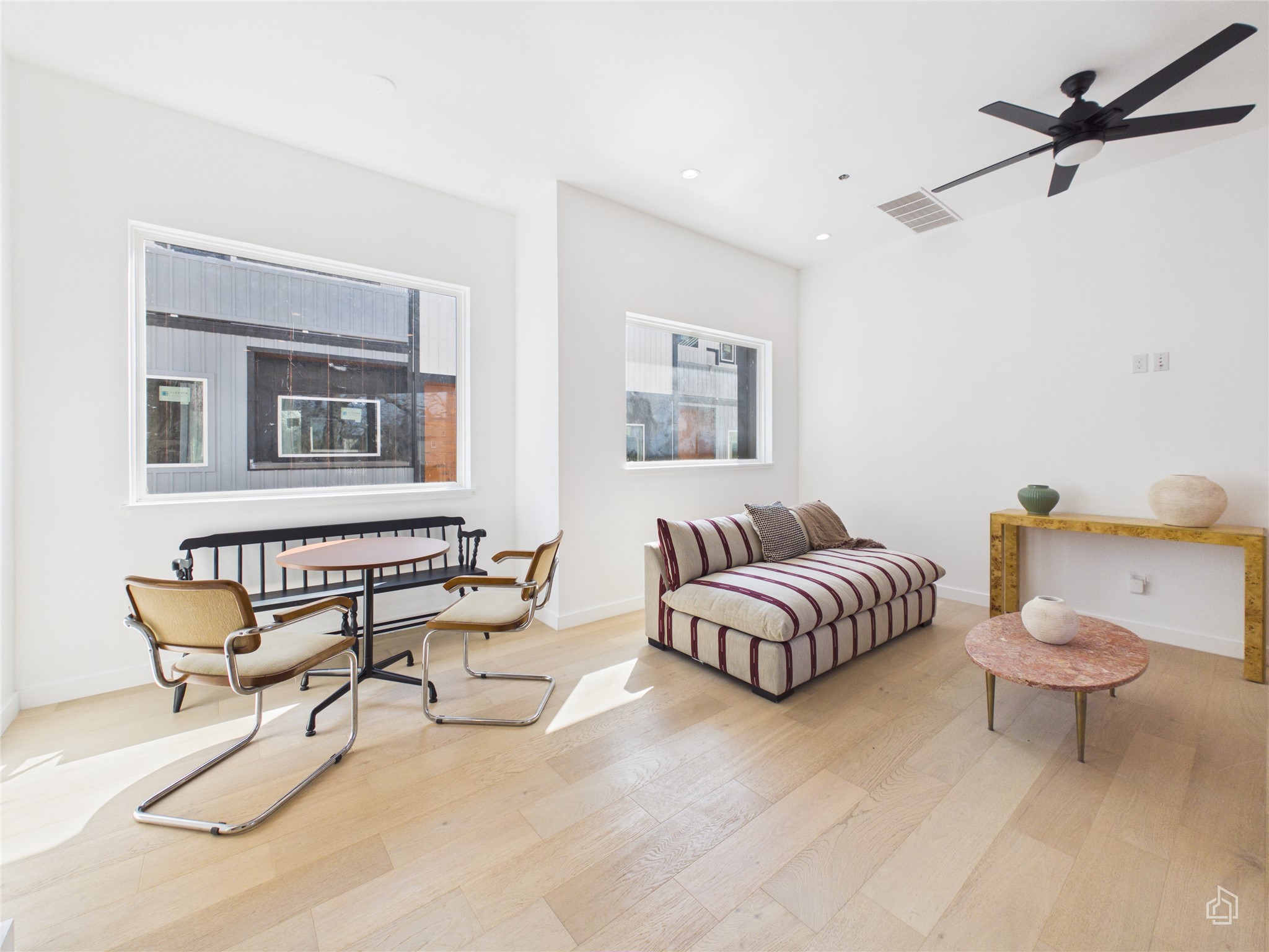 5912 Harold Court, Unit 105 Austin, TX 78721 - Photo 16 of 32 a living room with furniture and a rug